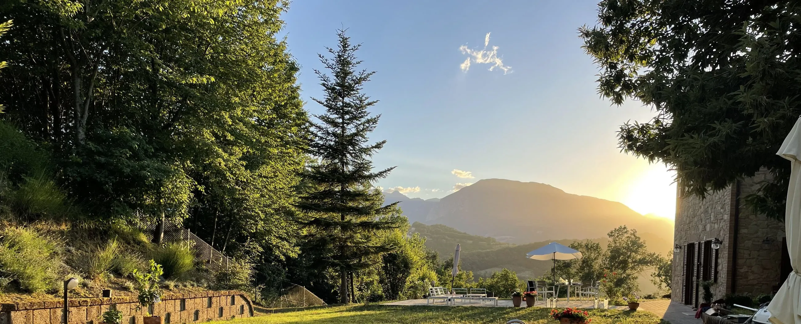 The private pool at golden hour, the sun setting behind the mountains